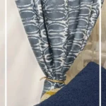 Indigo blue abstract patterned curtain fabric with soft white detailing, premium cotton linen drapery for modern living room and bedroom interiors