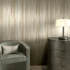 ARMANI / CASA Refined Structure 2 luxury wallcovering with soft flowing texture and vertical movement in warm ivory and champagne tones for refined interiors
