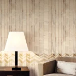 ARMANI / CASA Refined Structure 2 luxury wallcovering featuring layered stone textures and soft geometric chevron accents in warm ivory and champagne tones for elegant premium interiors.