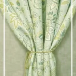 Light green floral curtain with elegant paisley pattern tied with rope tieback, perfect for living room and bedroom home decor