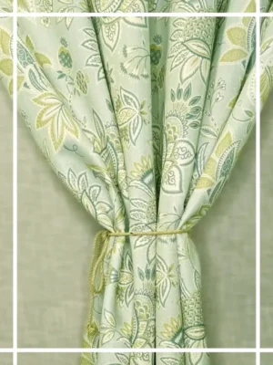 Light green floral curtain with elegant paisley pattern tied with rope tieback, perfect for living room and bedroom home decor
