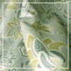 Light green floral curtain with elegant paisley pattern tied with rope tieback, perfect for living room and bedroom home decor