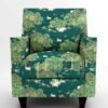 Luxury emerald green forest wildlife print upholstery fabric on accent chair with trees and animals, premium sofa and cushion upholstery for elegant living room interiors