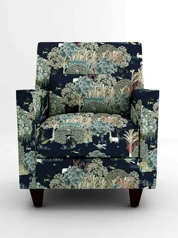 Luxury botanical forest print upholstery fabric on accent chair with deer and foliage motifs, premium sofa and cushion upholstery for elegant living room interiors