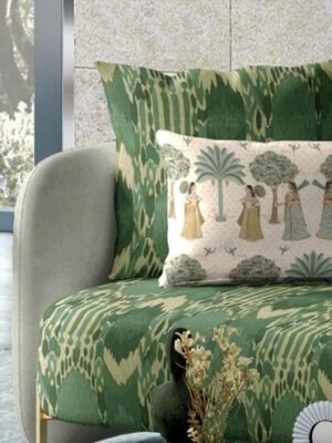 Green ikat patterned upholstery fabric with coordinating printed cushion, premium sofa and cushion fabric for stylish modern interiors