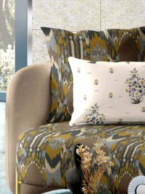 Luxury ikat pattern upholstery fabric on modern sofa with designer cushion, premium sofa and cushion fabric for elegant contemporary living room interiors