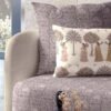 Luxury traditional printed upholstery fabric sofa with ethnic motif cushion cover in soft grey and beige tones for elegant living room interiors
