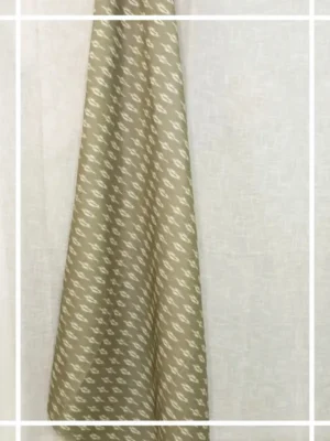 Olive green ikat pattern curtain fabric with subtle ethnic motifs on a neutral base, designer curtains for modern Indian interiors.