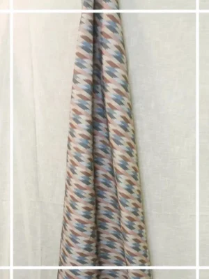 Pastel multicolor ikat pattern curtain fabric with geometric motifs, modern designer curtains for contemporary Indian interiors.