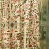 Traditional floral printed curtain fabric with red and green Persian motifs on beige cotton base, elegant decorative drapery fabric for living room and bedroom interiors