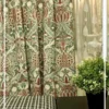 Ottoman Persian inspired curtain fabric with intricate floral and ornamental motifs in green and maroon tones, luxury traditional curtains for elegant interiors.