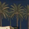 Indian heritage wallpaper mural featuring a sacred cow and calf in miniature painting style with palm trees, deep navy sky, lush greenery, and golden decorative border.