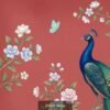 Luxury peacock wall mural sitting on tree branch with floral blossoms and butterflies on red background, elegant Indian wallpaper for home décor.