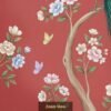 Luxury peacock wall mural sitting on tree branch with floral blossoms and butterflies on red background, elegant Indian wallpaper for home décor.