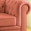 Luxury coral pink geometric sofa upholstery fabric with woven texture and nailhead detailing, premium furniture fabric for elegant living room interiors
