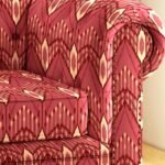 Luxury ikat pattern upholstery fabric in rich red tones for sofa and chair, premium designer furniture fabric for elegant living room interiors