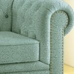 Luxury sage green floral jacquard sofa upholstery fabric with intricate woven texture and nailhead trim, premium furniture fabric for elegant living room interiors