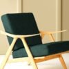 Modern upholstered lounge chair with deep green textured upholstery fabric and solid wooden frame, showcasing premium sofa and chair upholstery fabric for luxury living room interiors