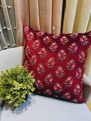 Luxury embroidered floral cushion cover fabric in deep maroon, premium upholstery textile with handcrafted detailing for elegant interiors