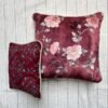 Luxury burgundy floral cushion cover fabric with soft blush roses and delicate botanical detailing, styled for elegant premium interiors.