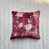 Luxury burgundy floral cushion cover fabric with soft blush roses and delicate botanical detailing, styled for elegant premium interiors.