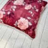 Luxury burgundy floral cushion cover fabric with soft blush roses and delicate botanical detailing, styled for elegant premium interiors.