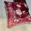 Luxury burgundy floral cushion cover fabric with soft blush roses and delicate botanical detailing, styled for elegant premium interiors.