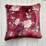 Luxury burgundy floral cushion cover fabric with soft blush roses and delicate botanical detailing, styled for elegant premium interiors.