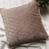 Luxury taupe geometric cushion cover fabric with elegant hexagon texture, styled on neutral bedding for premium modern interiors.