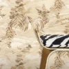 Roberto Cavalli Volume 9 luxury embossed wallpaper with abstract palm leaf design in warm gold and beige tones on a textured stone-effect background