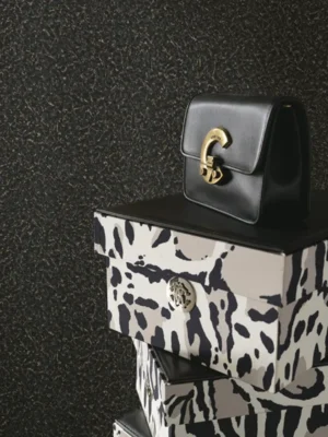 Dark charcoal textured luxury wallpaper with subtle metallic grain finish for modern and premium interiors