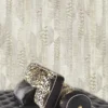 Roberto Cavalli Volume 8 luxury wallpaper with light geometric patchwork inspired by exotic animal textures in ivory, cream and soft beige tones for premium interiors