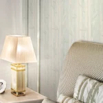 ARMANI / CASA Refined Structure 2 luxury wallcovering featuring an elegant ivory textured surface with subtle botanical impressions, designed for sophisticated premium interiors and contemporary luxury spaces.