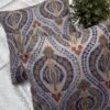 Luxury paisley cushion covers in beige and royal blue with intricate floral motifs, premium woven fabric decorative pillows for elegant living room and bedroom interiors.