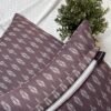 Luxury mauve ikat pattern cushion covers in premium woven fabric, styled on a soft neutral surface with modern décor accents for elegant living room interiors.