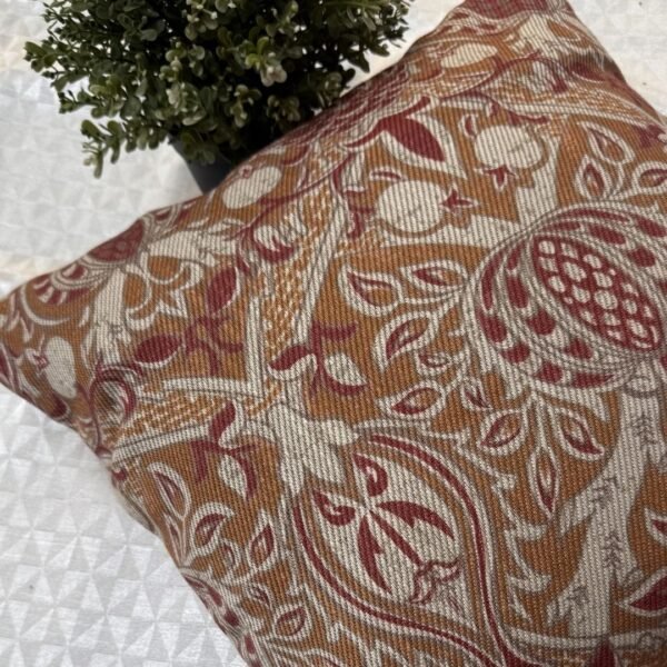 Designer woven cushion cover in warm terracotta and rust tones with cream floral paisley pattern, luxury bespoke pillow for premium living room decor