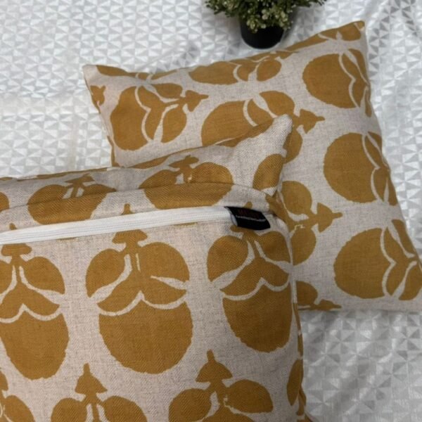 Mustard floral designer cushion covers in premium beige textured fabric with concealed zipper closure, styled for luxury modern interiors.