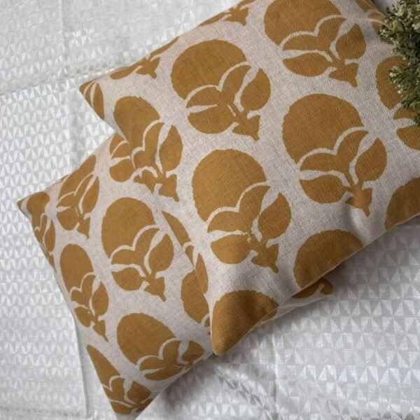 Mustard floral designer cushion covers in premium beige textured fabric with concealed zipper closure, styled for luxury modern interiors.