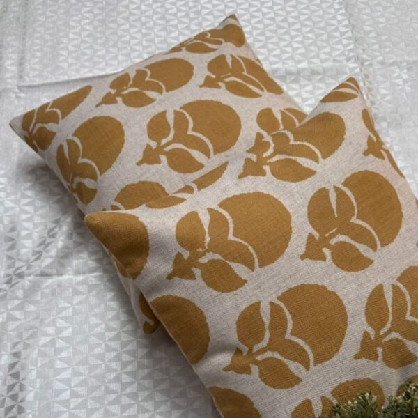 Mustard floral designer cushion covers in premium beige textured fabric with concealed zipper closure, styled for luxury modern interiors.