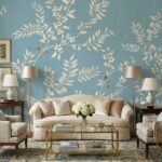 Elegant blue floral mural wallpaper with delicate white botanical branches and birds in a luxury bedroom setting with wooden bed, soft lighting, and classic décor