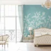 Elegant teal floral mural wallpaper with white botanical branches and birds, styled in a luxury classic bedroom interior with vintage furniture and soft lighting