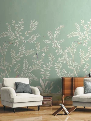 Elegant sage green floral mural wallpaper with white botanical branches and birds in a modern living room with teal sofa, wooden accents, and neutral décor