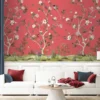 Luxury red floral mural wallpaper with hand-painted daisy blossoms, birds and botanical branches, Daisy Bennett mural collection by RUBY, elegant living room feature wall design
