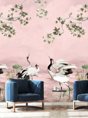 Elegant pink mural wallpaper featuring artistic cranes, lotus elements, and delicate tree branches with green leaves, styled with modern blue lounge chairs in a luxury interior by RUBY Furnishing Studio Ghatkopar East Mumbai.