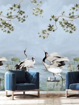 Luxury blue mural wallpaper featuring elegant cranes, lotus elements, and flowing botanical branches on a soft sky-blue background, styled with modern blue armchairs in a premium living room by RUBY Furnishing Studio Ghatkopar East Mumbai.