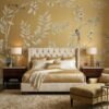 Elegant golden yellow floral mural wallpaper with delicate tree branches, blooming flowers, and birds in a luxury living room with blush seating and ornate mirror