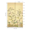 Elegant golden yellow floral mural wallpaper with delicate tree branches, blooming flowers, and birds in a luxury living room with blush seating and ornate mirror