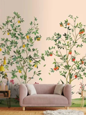 Elegant botanical mural wallpaper featuring hand-painted citrus trees with oranges, lemons, and delicate birds on a soft peach background, styled in a modern living room with a green velvet sofa and natural wood furniture.