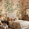 Elegant botanical mural wallpaper featuring hand-painted citrus trees with oranges, lemons, and delicate birds on a soft peach background, styled in a modern living room with a green velvet sofa and natural wood furniture.