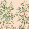 Elegant botanical mural wallpaper featuring hand-painted citrus trees with oranges, lemons, and delicate birds on a soft peach background, styled in a modern living room with a green velvet sofa and natural wood furniture.